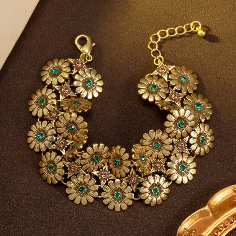A Vintage Bracelet/Necklace Featuring a Floral And Star Pattern
