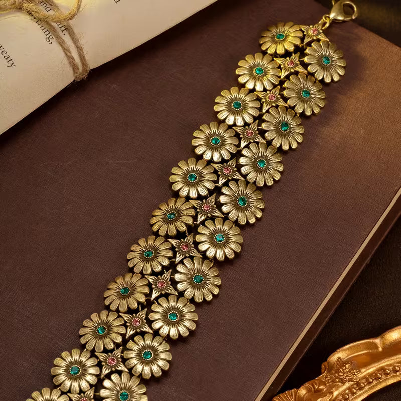 A Vintage Bracelet/Necklace Featuring a Floral And Star Pattern