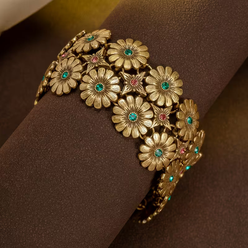A Vintage Bracelet/Necklace Featuring a Floral And Star Pattern